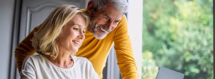 Man and Woman viewing retirement income options
